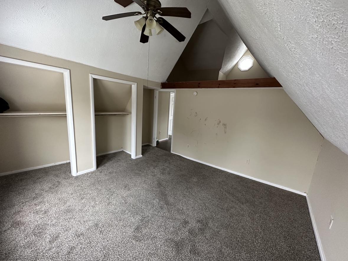 room with gray carpet