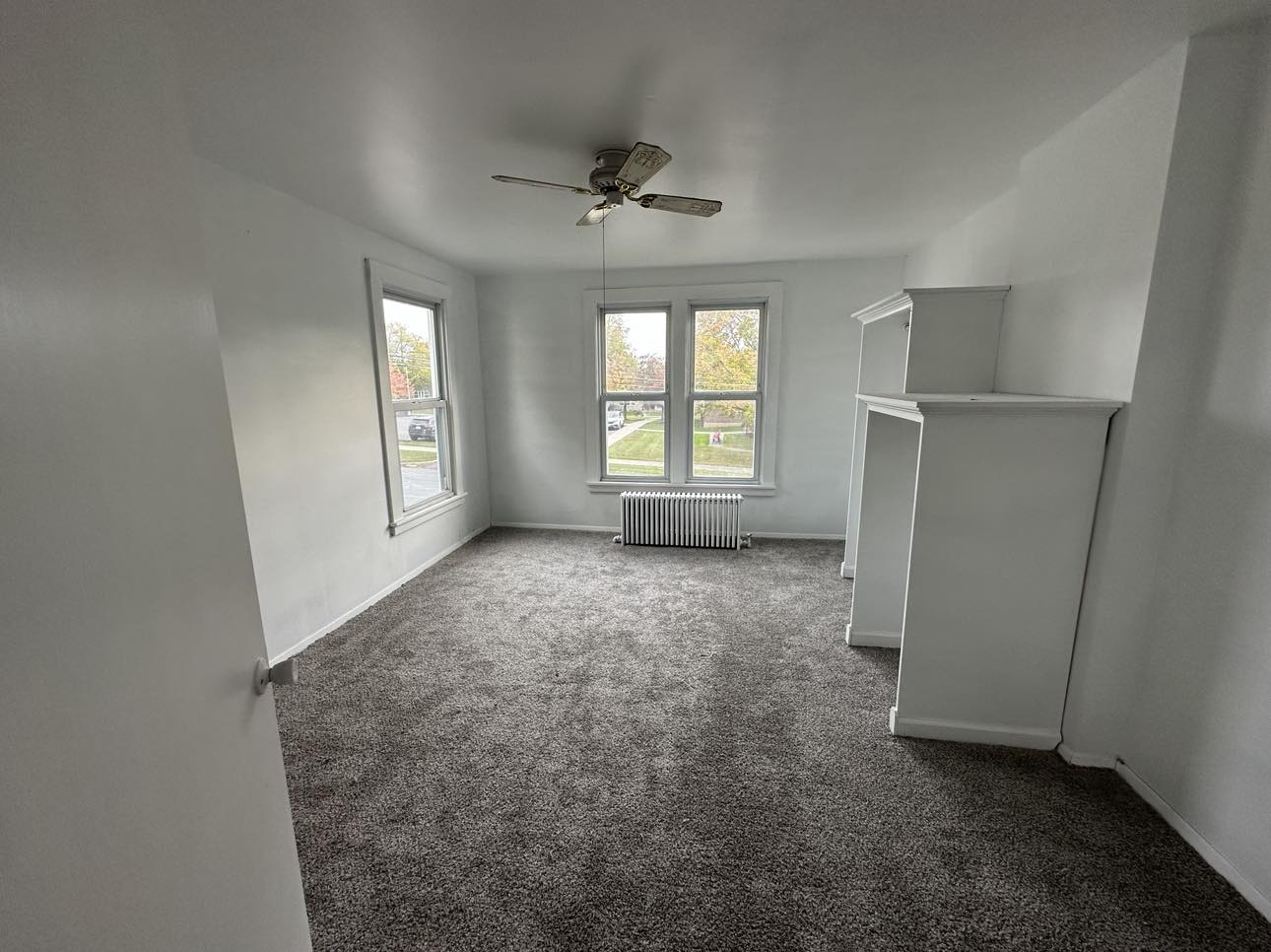 living room with a gray carpet