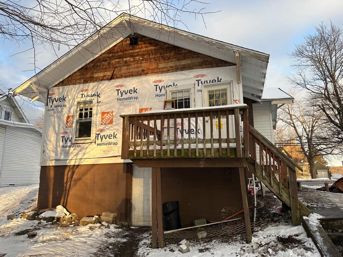 old wooden home with deck