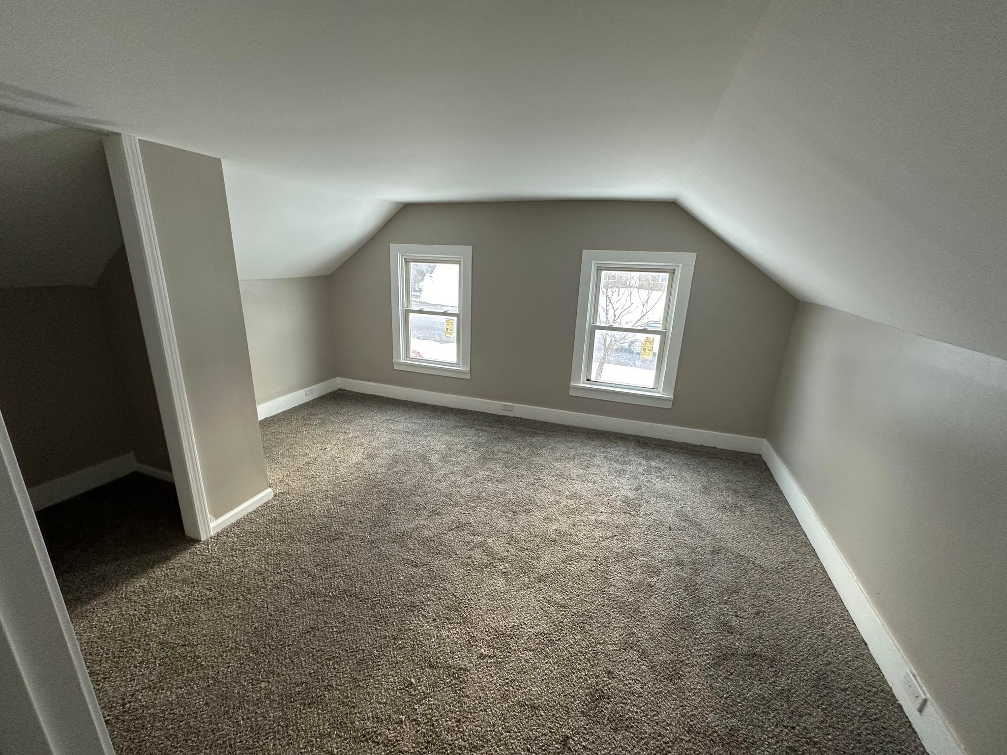 room with gray carpet