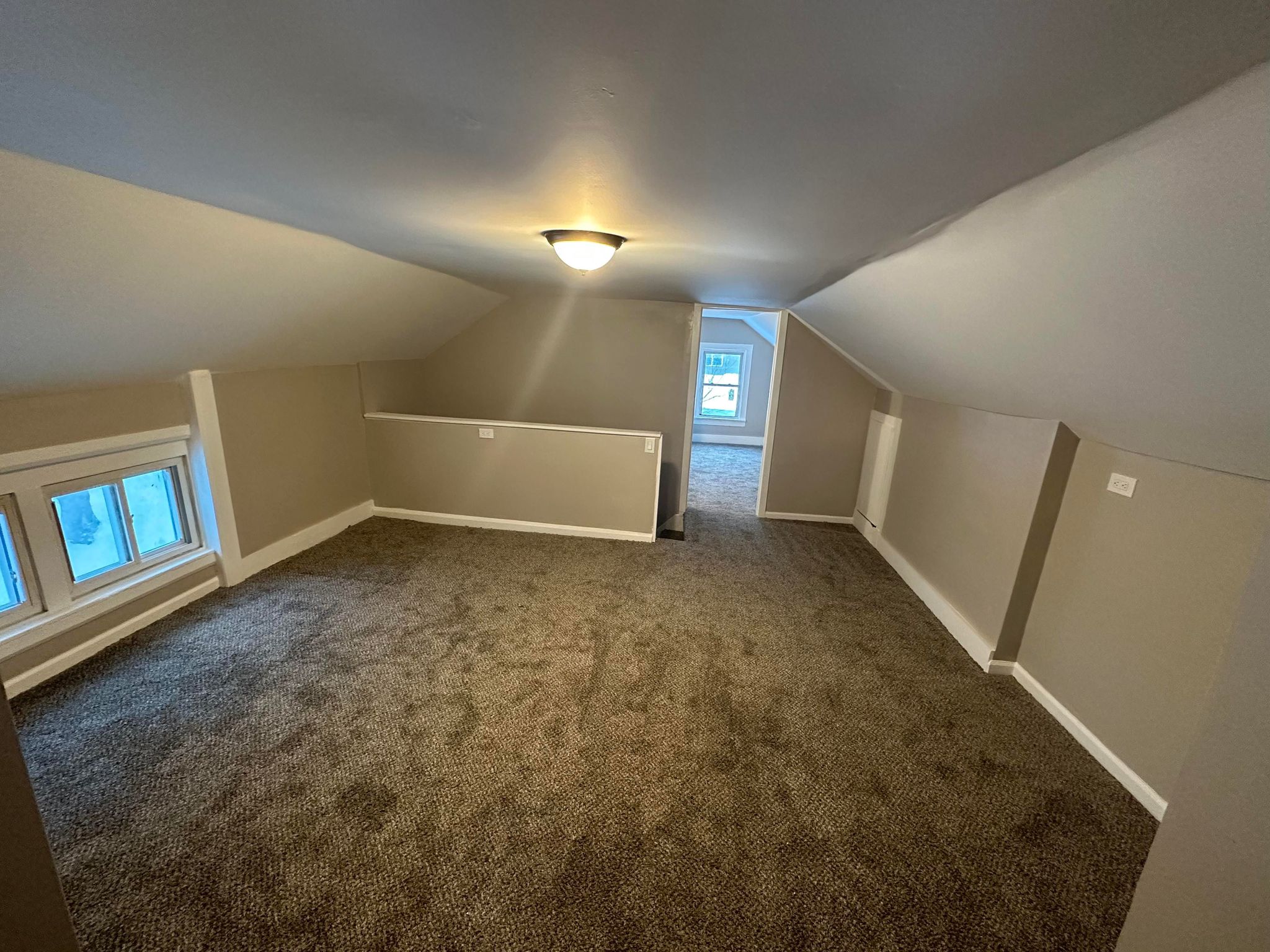 room with gray carpet