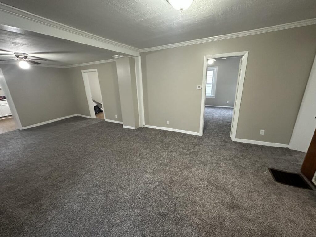 room with a gray carpet