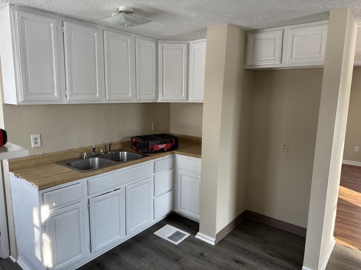 clean kitchen with gray carpet