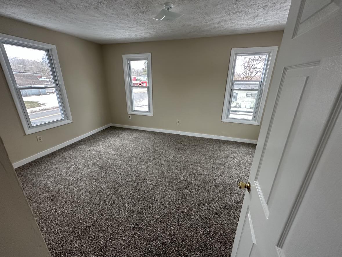 room with gray carpet