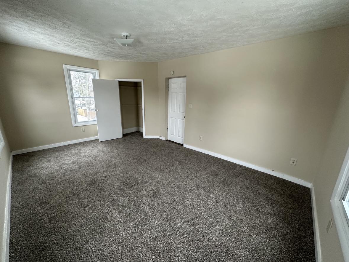 room with gray carpet