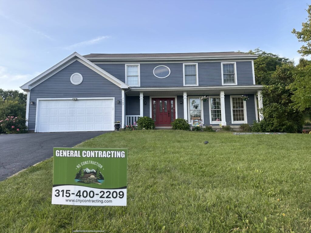 gray home with a garden