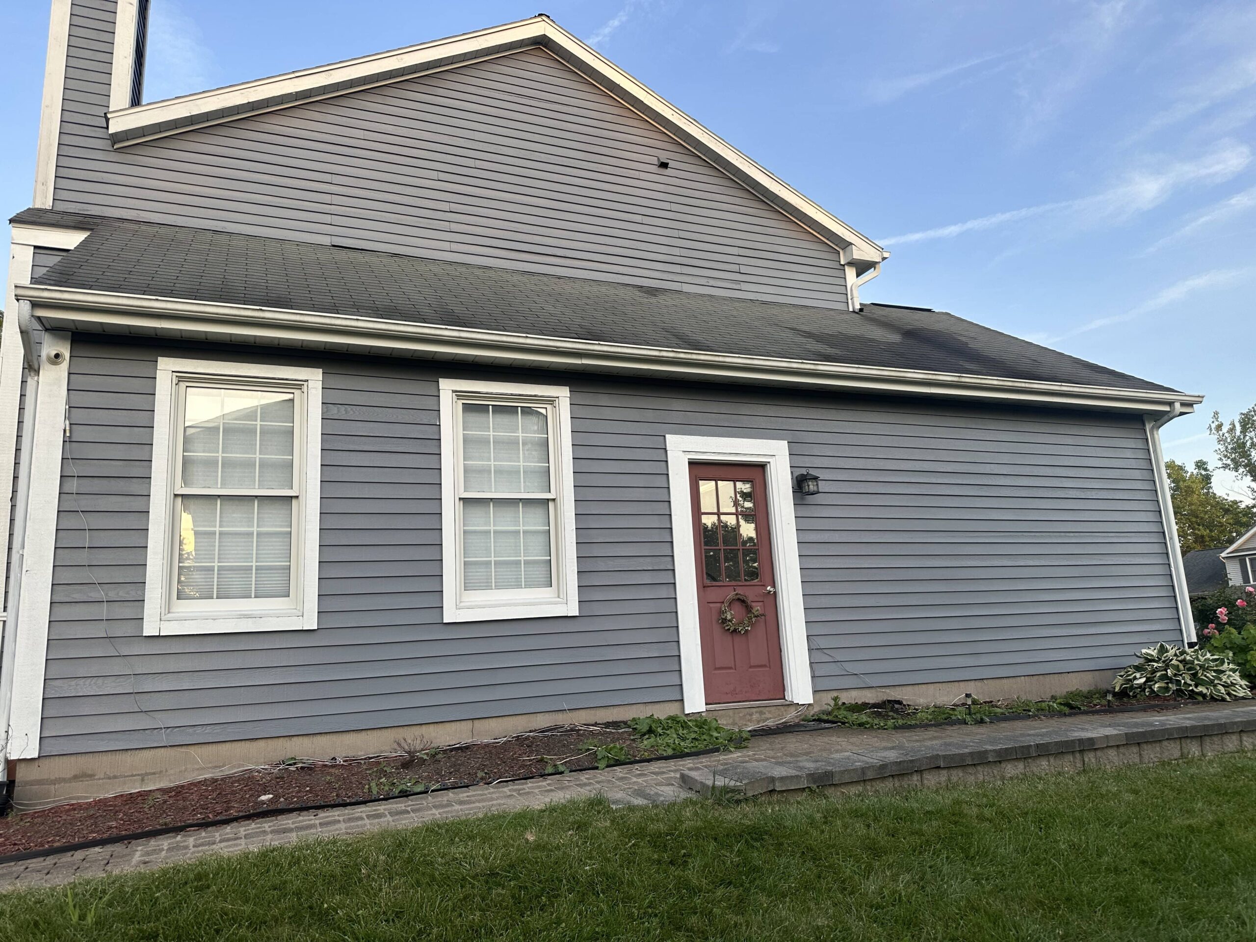 gray home with a garden