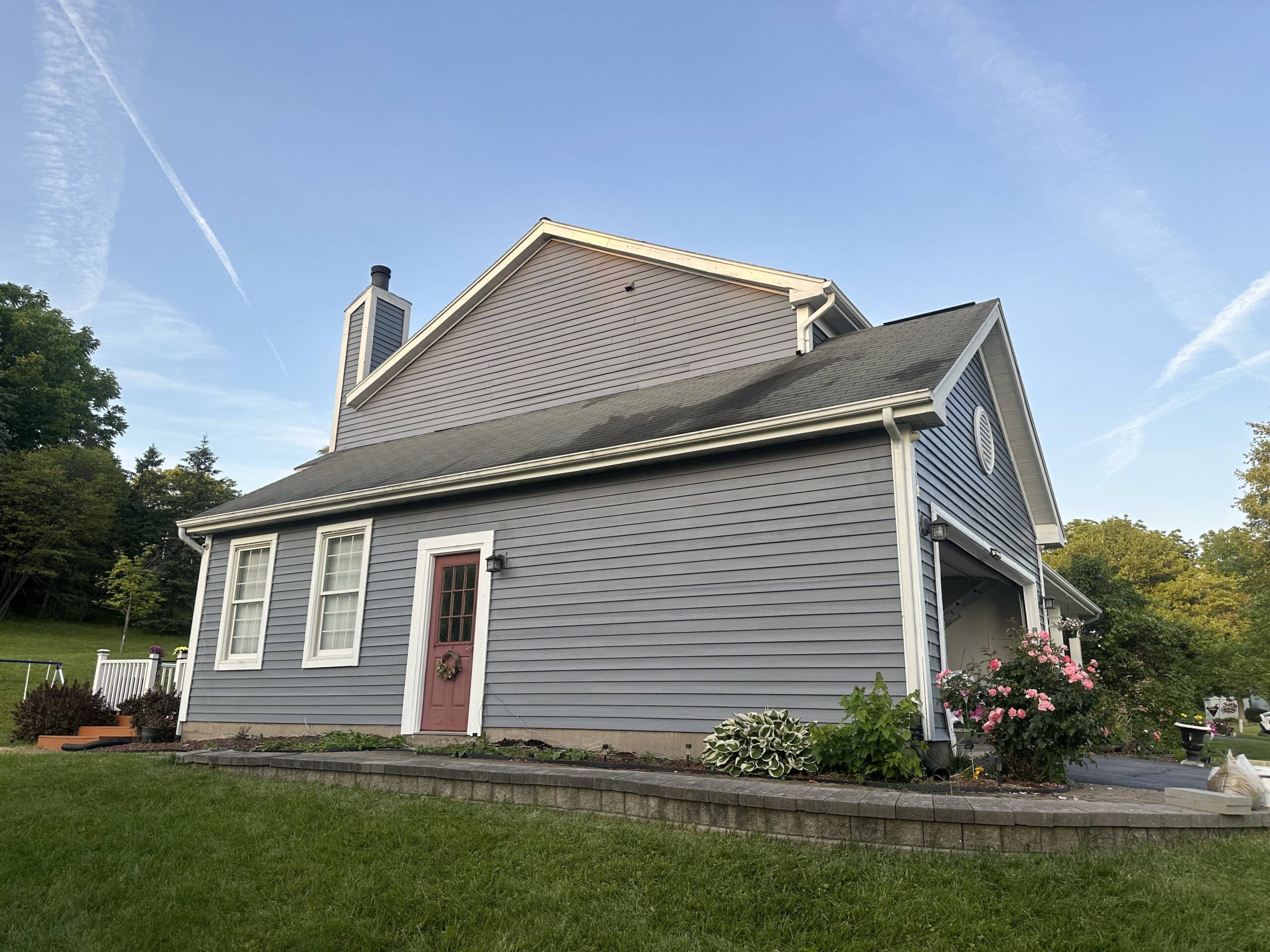 gray home with a garden