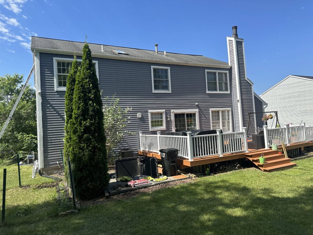 gray home with garden and trees