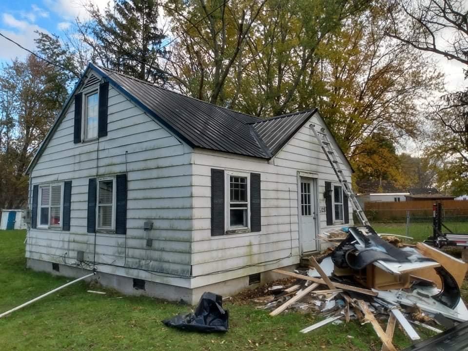 a white home with black roof