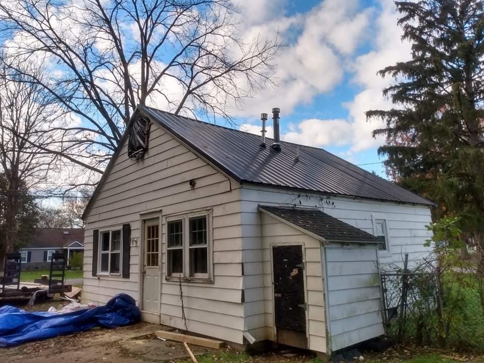 a white home with black roof