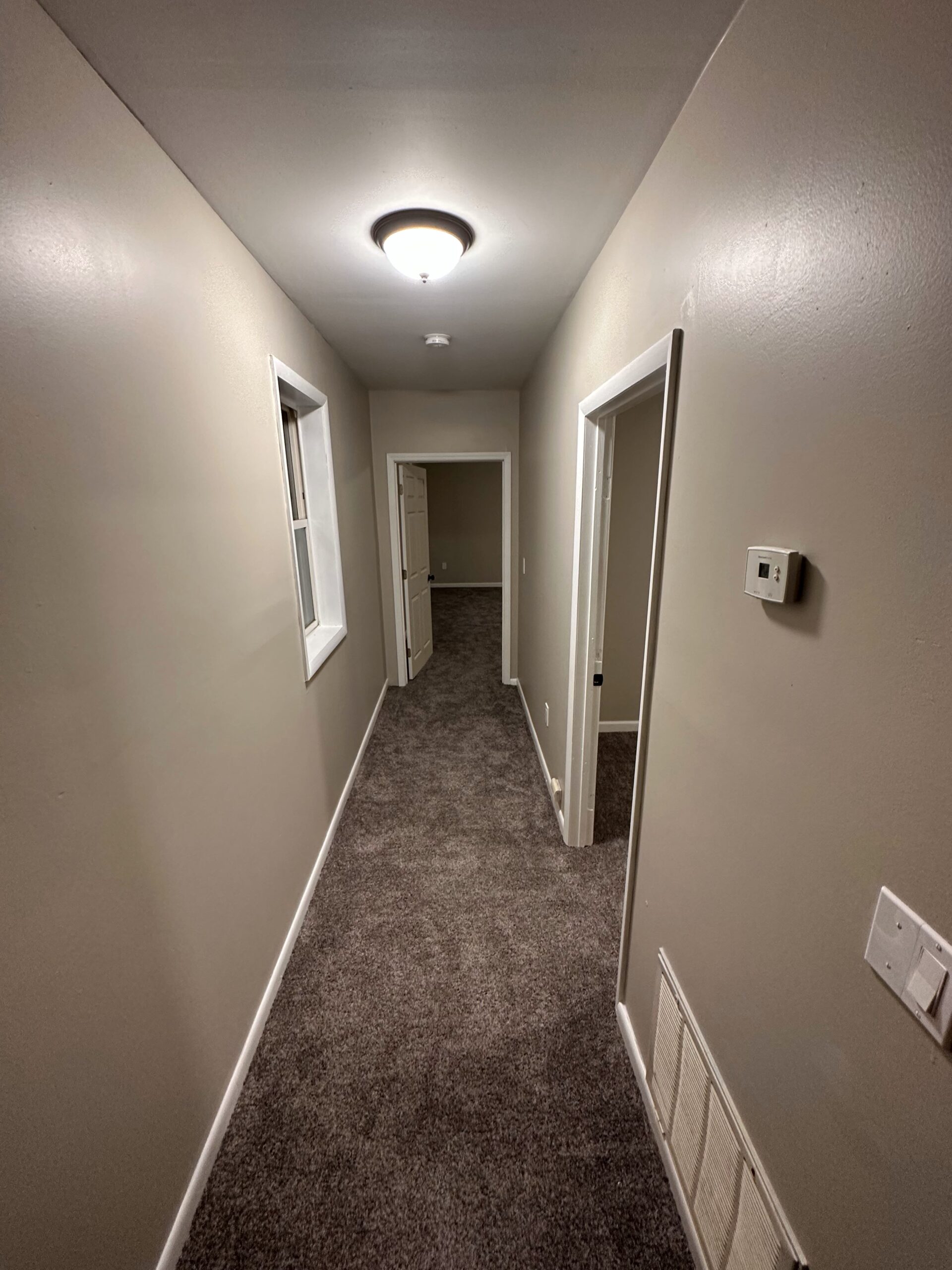 corridor with gray floor