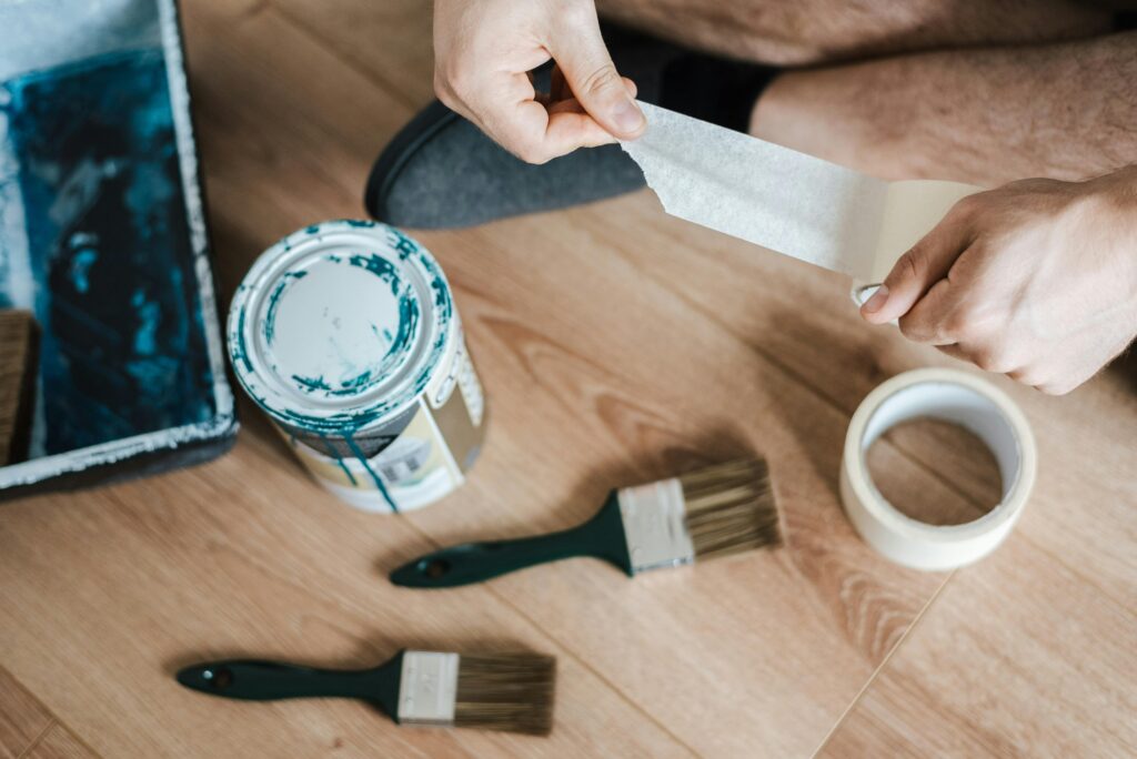 a man with a tape and brushes